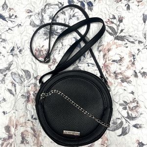 I am selling a madden girl, black Crossbody bag with a chained zipper